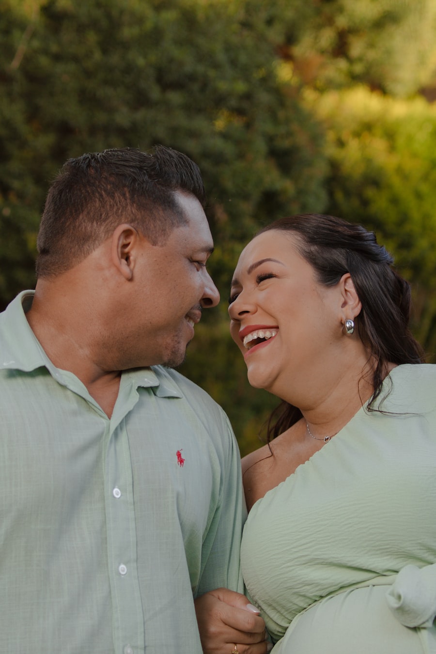 Couple laughing together outdoors